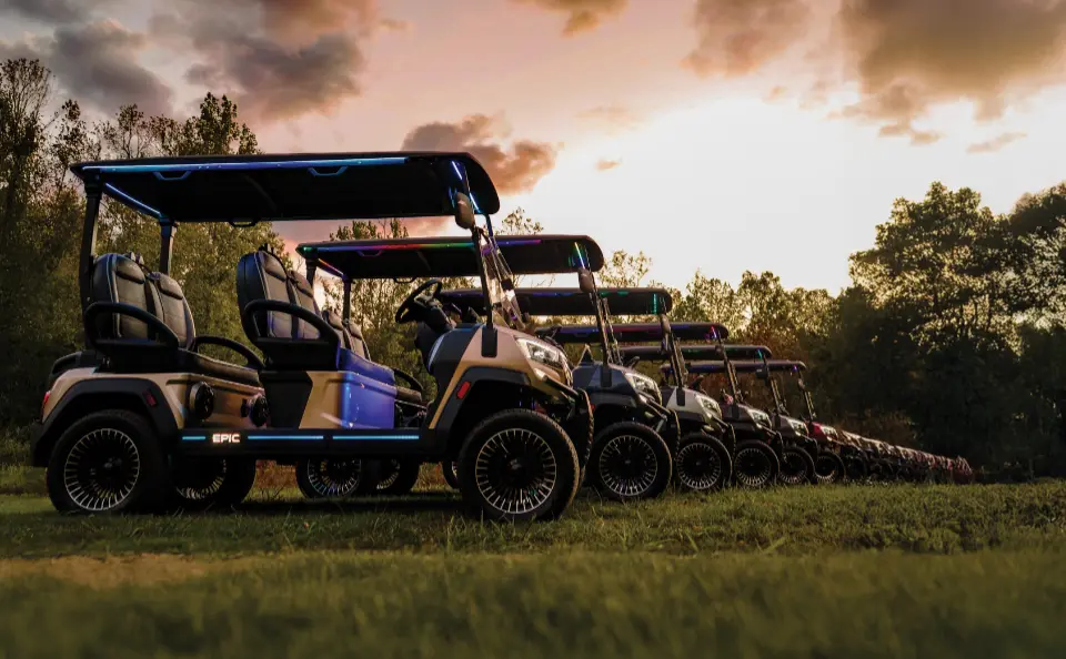 Epic Golf Carts lined up in a row during sunset